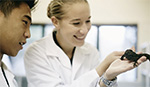 Bachelor of Science - two student examining a reptile